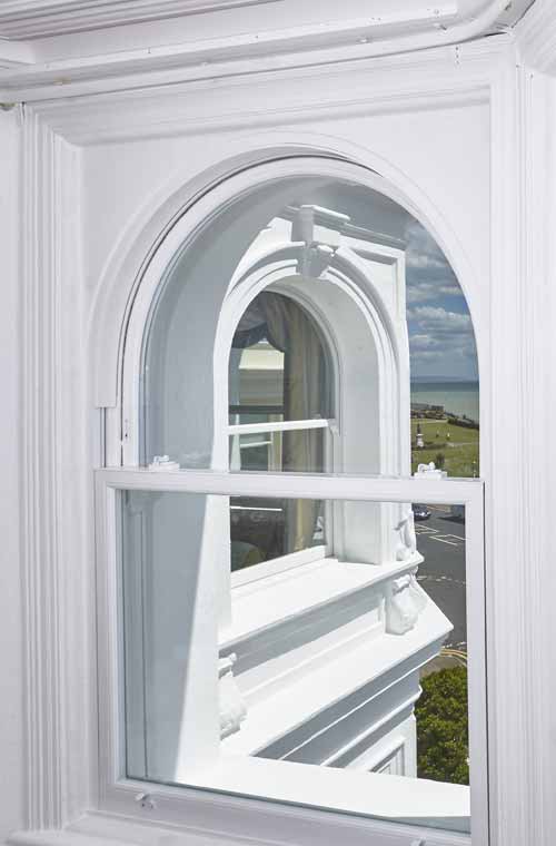 Heritage Rose arched uPVC sash window