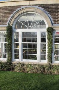 White uPVC sash windows with georgian detail