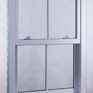 A white sash window with astragal bars