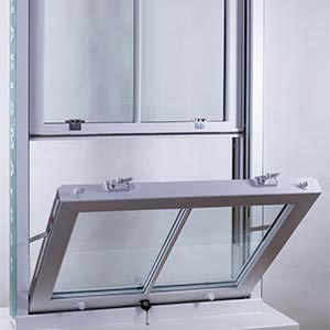 A slide and tilt window open on a white plinth