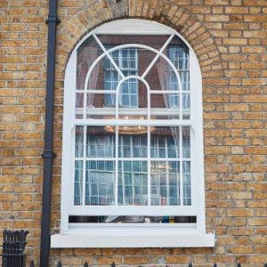 white sliding sash arch window