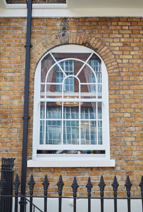 white sliding sash arch window